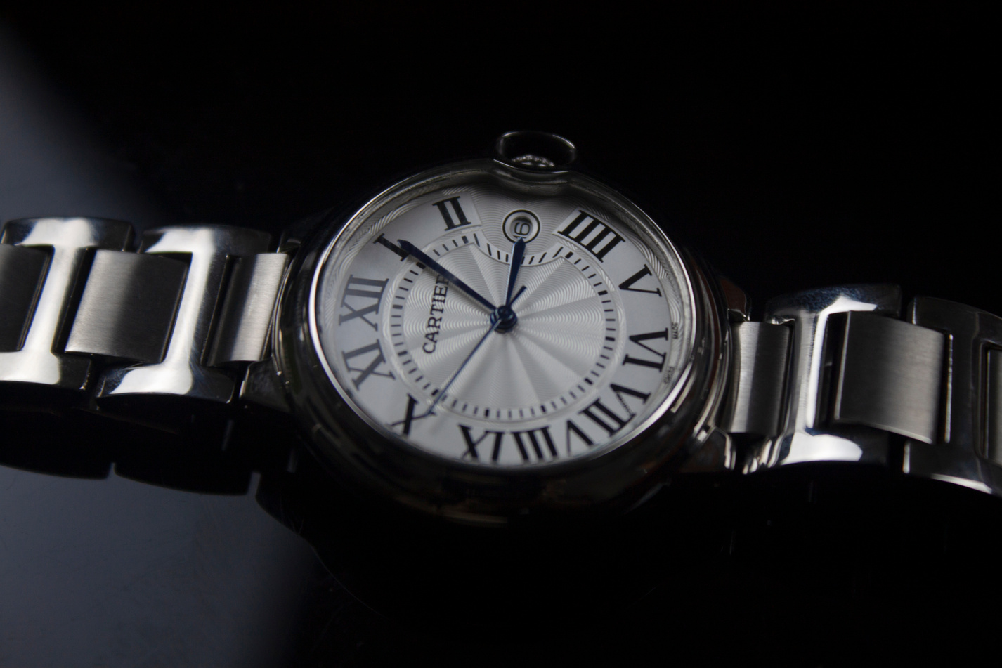 Studio Shot of a Wristwatch with Roman Numerals on Black Background