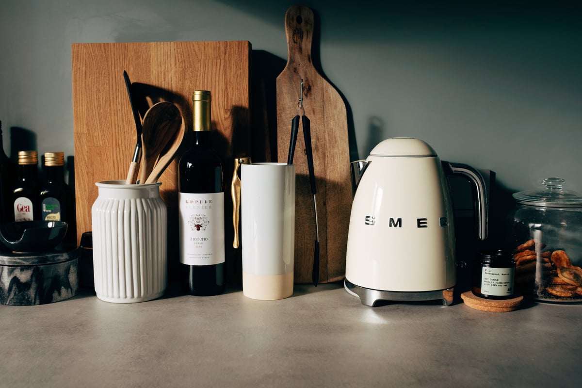 Kitchenware on stone counter in modern kitchen